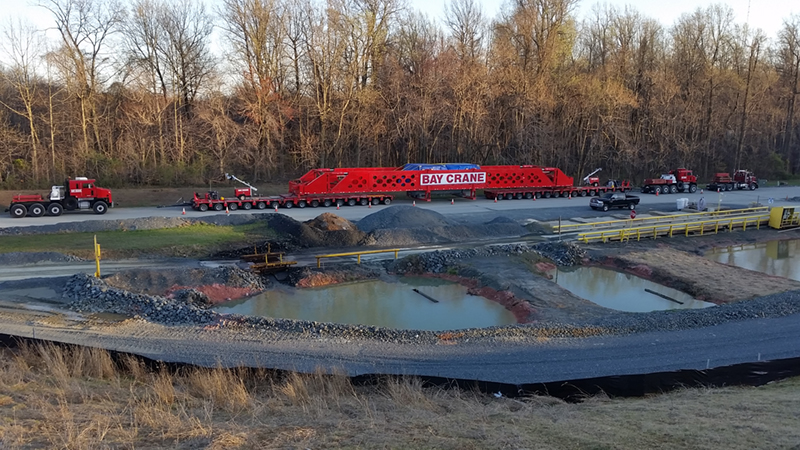 Bay Crane generator transport with suspension bridge and Oshkosh HET prime movers